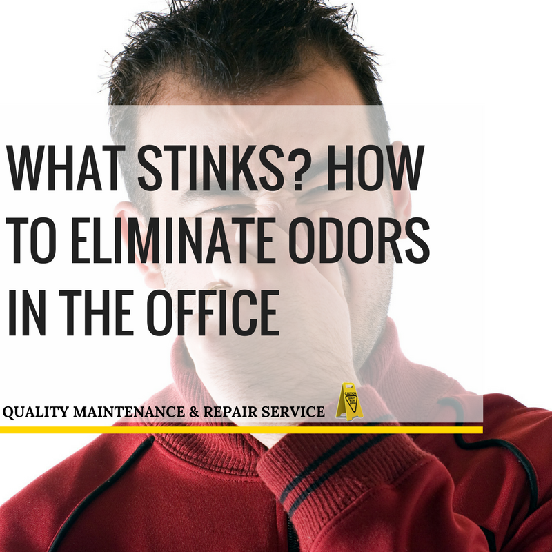 Man holding nose because of office odors.